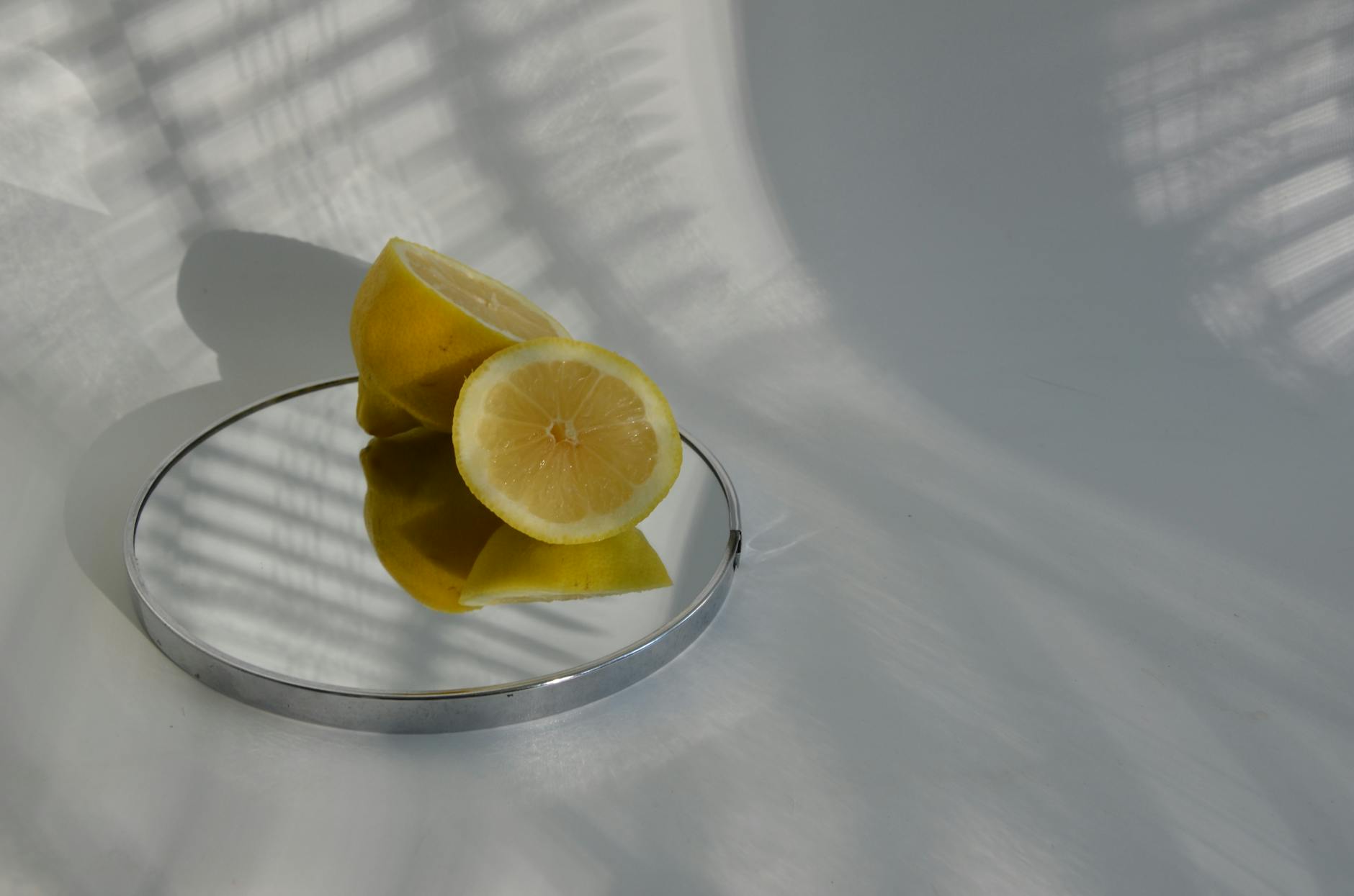 Hand holding a colorful lemon vibrator against a purple background