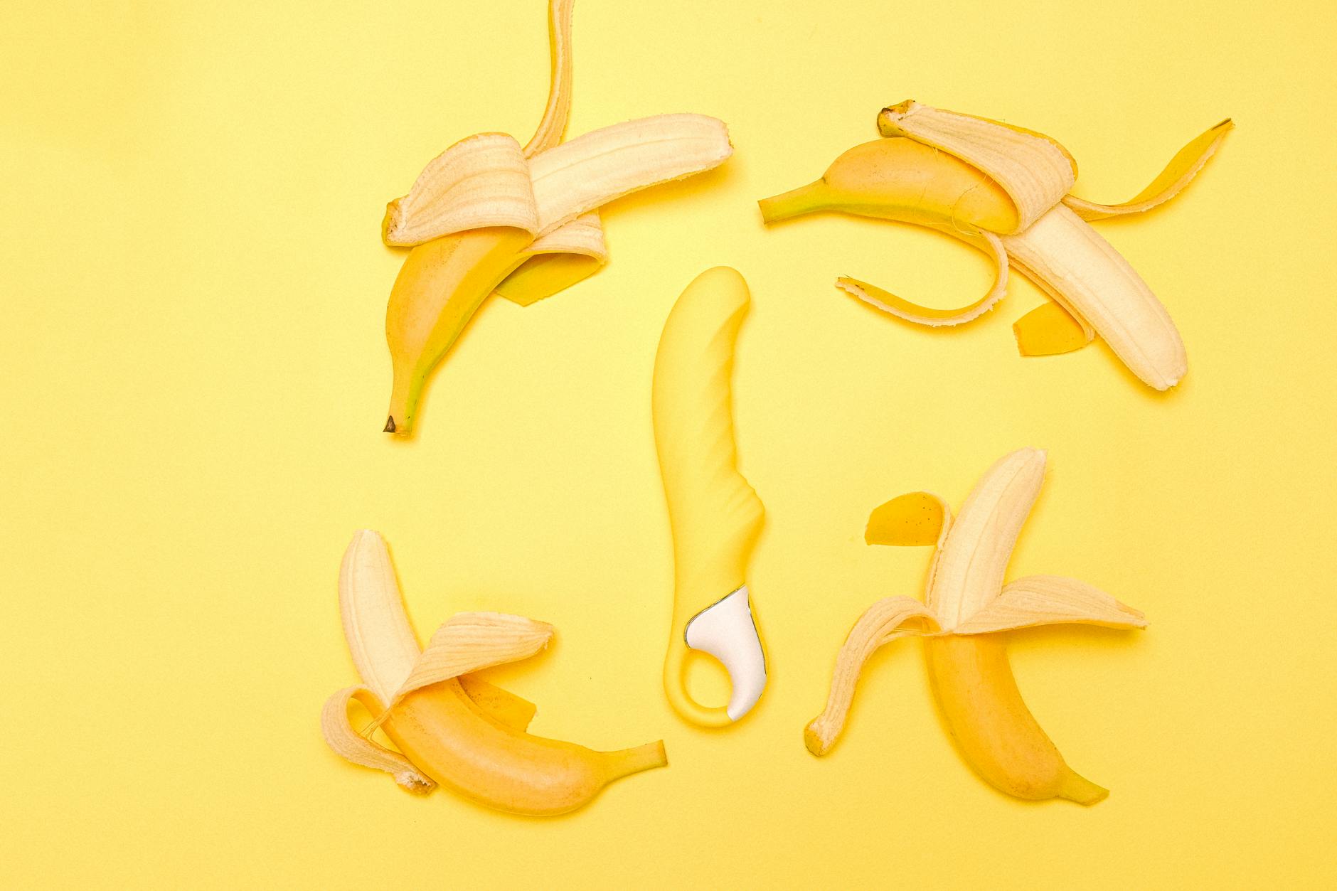 Yellow lemon vibrator on bright background representing fresh, gentle pleasure during recovery.